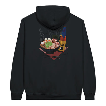 Black value hoodie featuring a print of a steaming bowl of ramen with eggs, seaweed, and slices of meat, accompanied by a bottle of sake and chopsticks, set on a red geometric background.