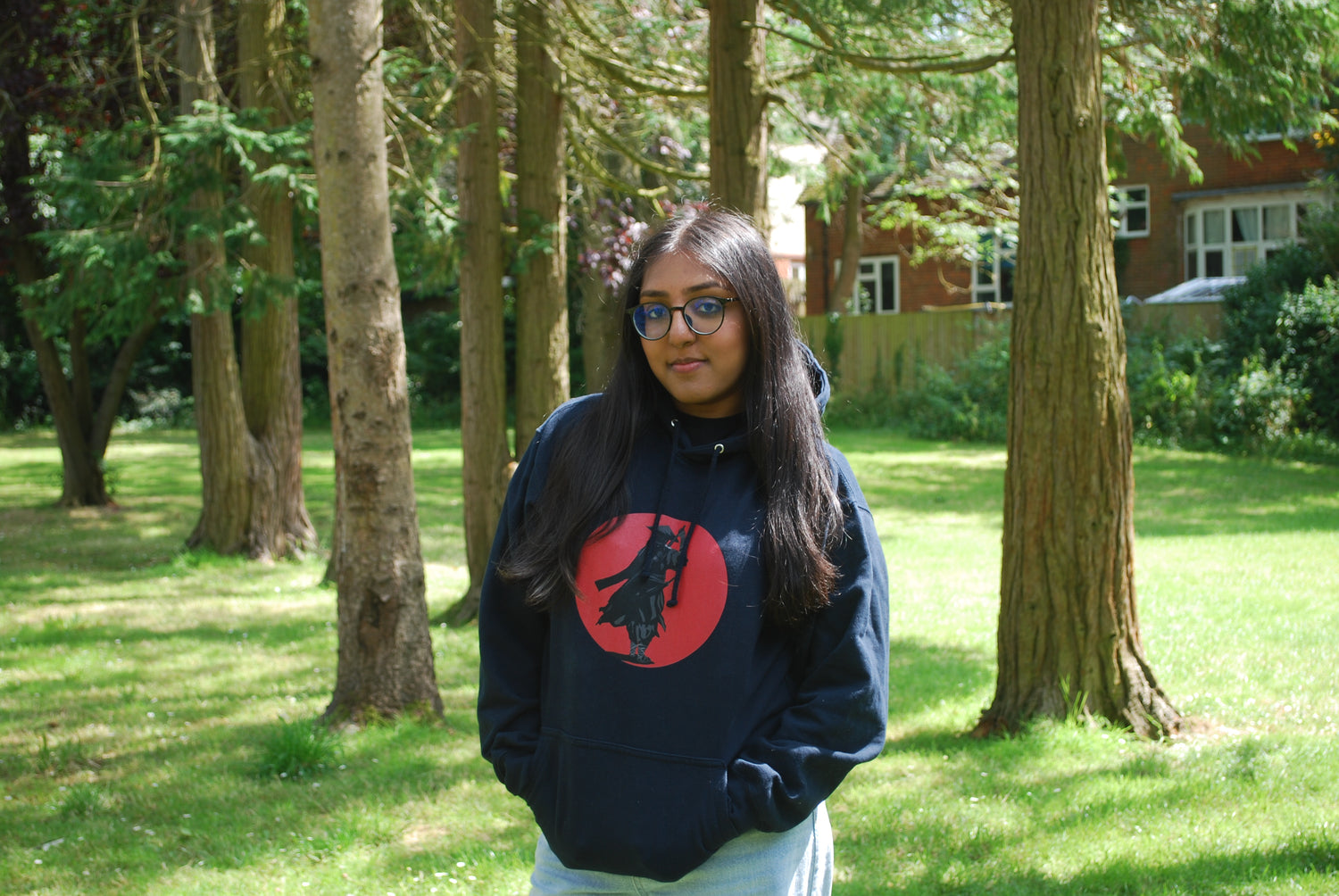 Woman modelling navy samurai hoodie front print.